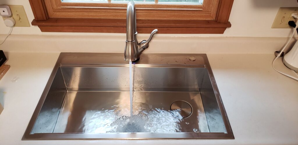 New kitchen sink install with water running